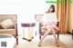 A woman sitting on a chair in a living room.